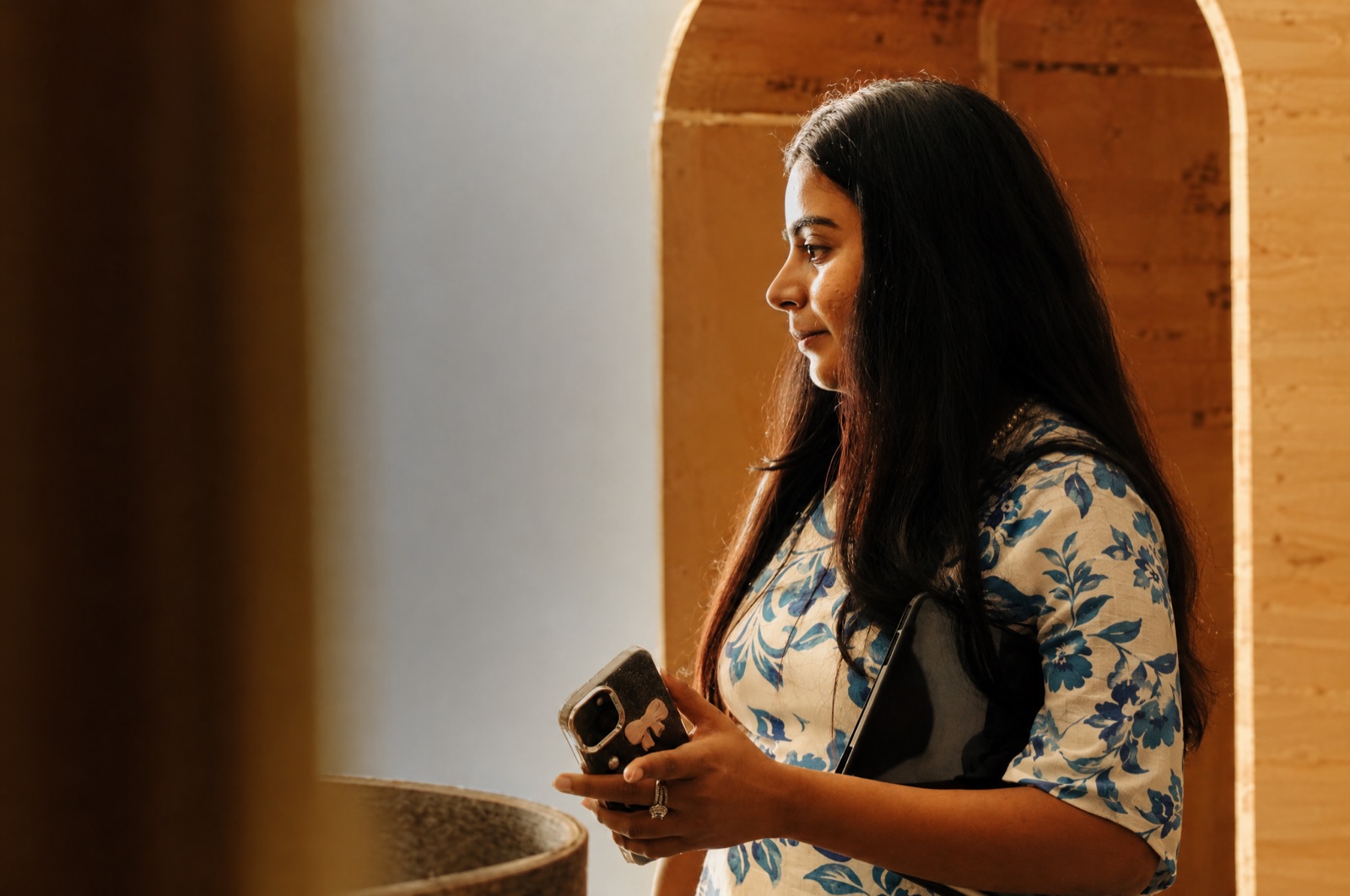 Surbhi on a site visit, standing by an arched doorway